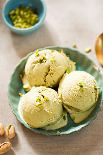 istock Pistachio ice creams on blue plate 812704204