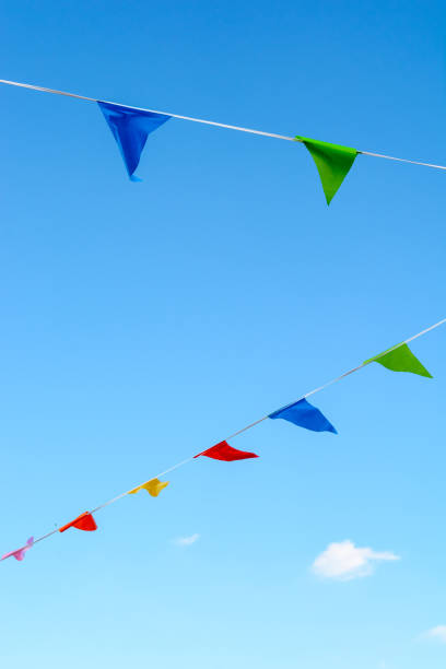 istock Colorful party flags against blue sky. 812710486