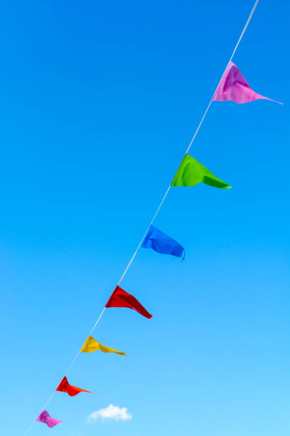 istock Colorful party flags against blue sky. 812710488