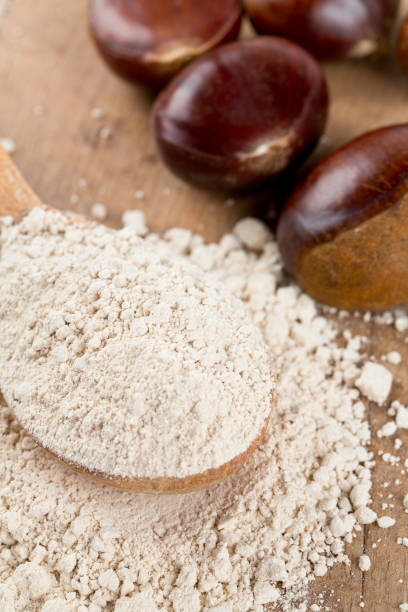 istock chestnut flour in a wooden spoon 812722550
