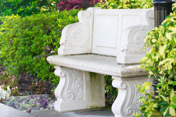 istock Stone bench in garden 812750744