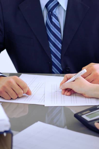 istock Bookkeepers or financial inspector making report, calculating or checking balance. Audit concept. 812754206