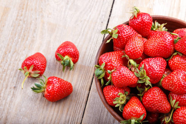 istock strawberry in a clay plate 812754230