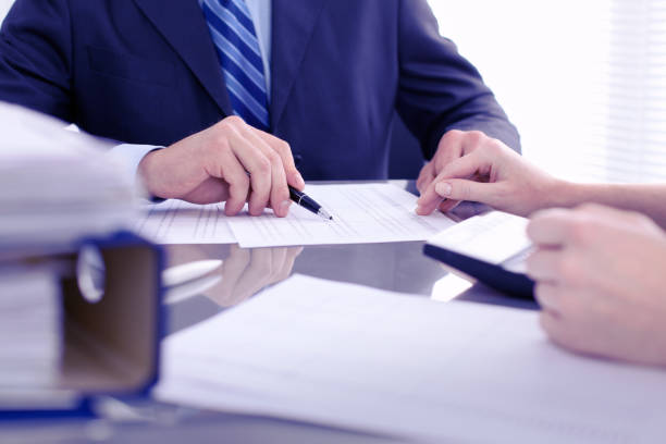 istock Bookkeepers or financial inspector making report, calculating or checking balance. Audit concept. 812754296