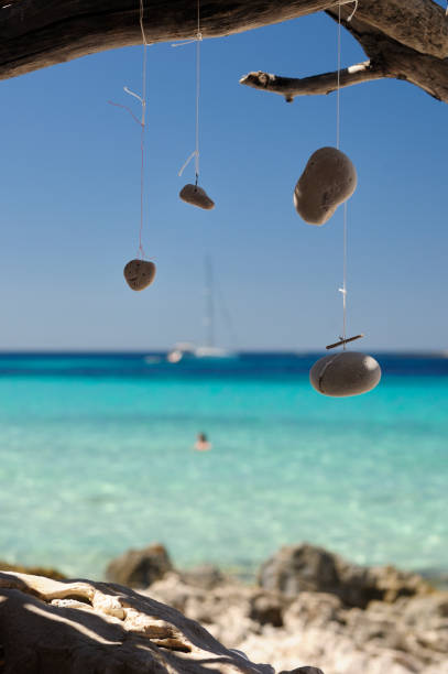 istock Wind Chime and dream catcher by the sea 812773978