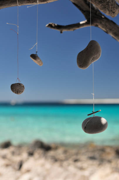 istock Dream catcher and wind chime by the sea 812773990