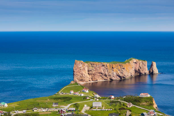 A look at the small town of Percé and its famous Rocher Percé (Perce Rock), part of the Gaspé peninsula in Québec. Travel photography. gulf of st lawrence photos stock pictures, royalty-free photos & images