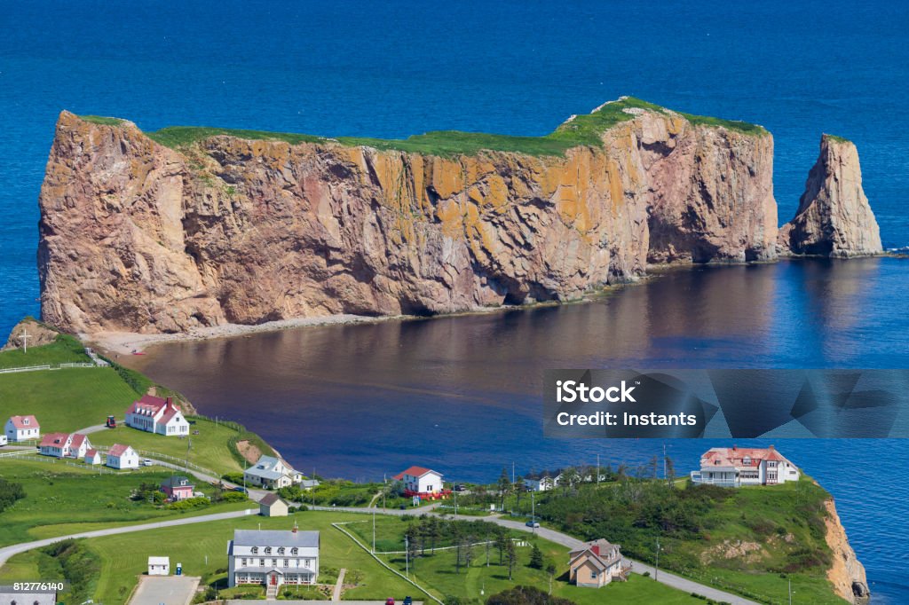 A look at the small town of Percé and its famous Rocher Percé (Perce Rock), part of the Gaspé peninsula in Québec. Travel photography. Awe Stock Photo