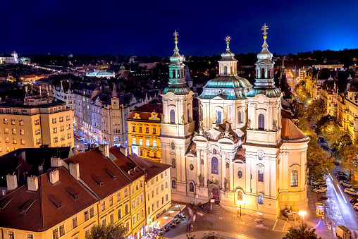 The Church of Saint Nicholas in the Old Town of Prague. View from Old Town Hall at night. Czech Republic.