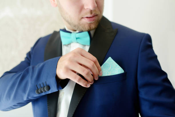 istock Groom is wearing a suit indoors 812790734