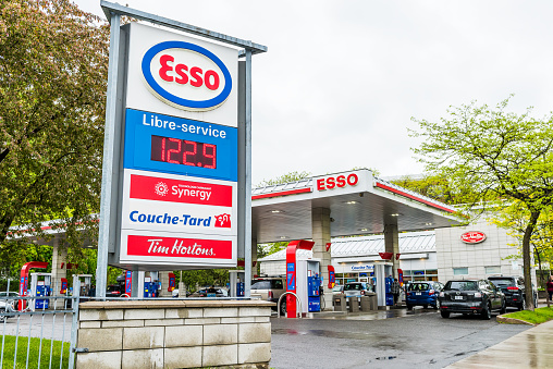 Montreal: Esso gas station in downtown for car fuel with prices and people