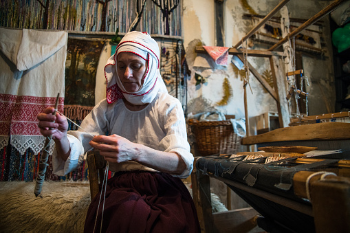 Local artisan make mosaic pieces and creating handmade items in old Medina market. Fes, Morocco - April 10 2016.