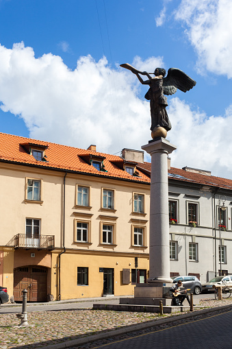 Streets of the unadmitted republic of Uzupis in Vilnius. The statue of the angel is the symbol of Uzupis. Uzupis is a neighborhood in Vilnius, the capital of Lithuania, largely located in Vilnius' old town.