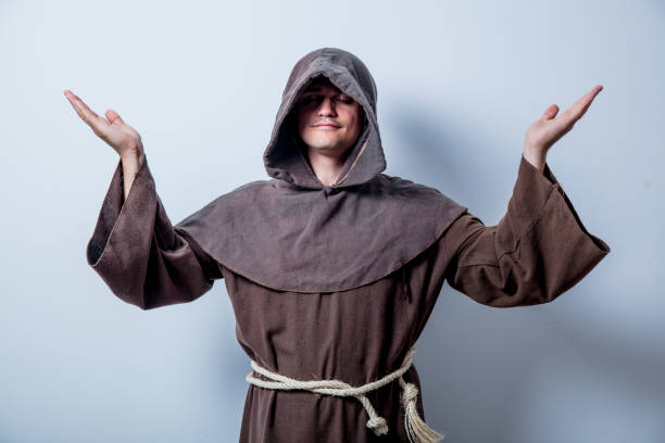 Portrait of Young catholic monk on white background