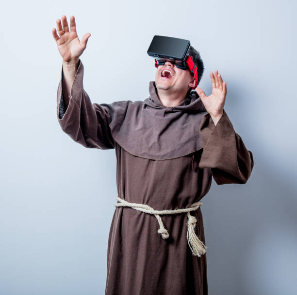 istock Portrait of Young catholic monk with 3D glasses 812815494