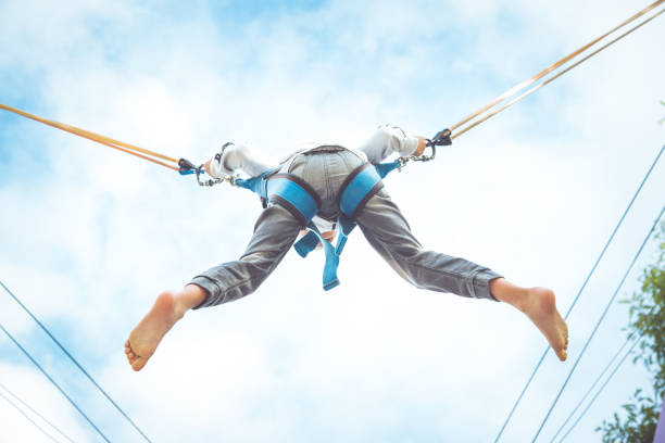 istock Little boy jumping at trampoline 812820734