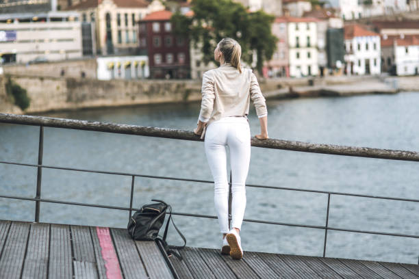 istock Young woman is watching to the river 812820878