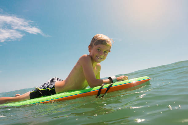 istock Young Boy Having Fun In The Ocean 812820998