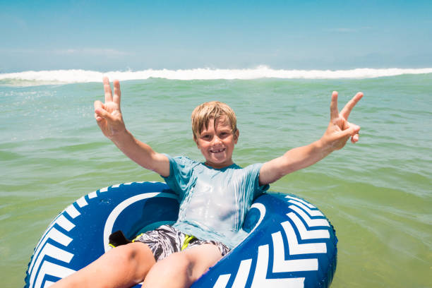 istock Young Boy Having Fun In The Ocean 812823622
