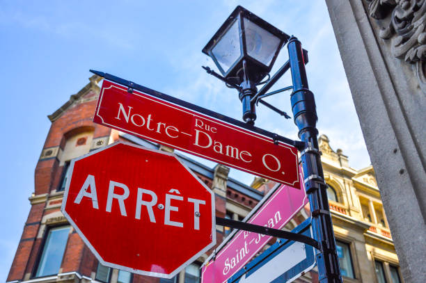 Montreal, Canada - June 15, 2017: Old lantern and stop sign on Notre-dame street,  in Old Port of the historical quarter in Montreal, Canada. The translation is \