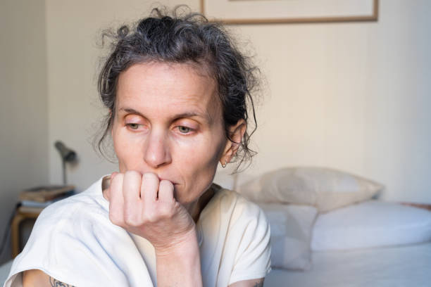 istock Middle aged woman in bedroom 812831790