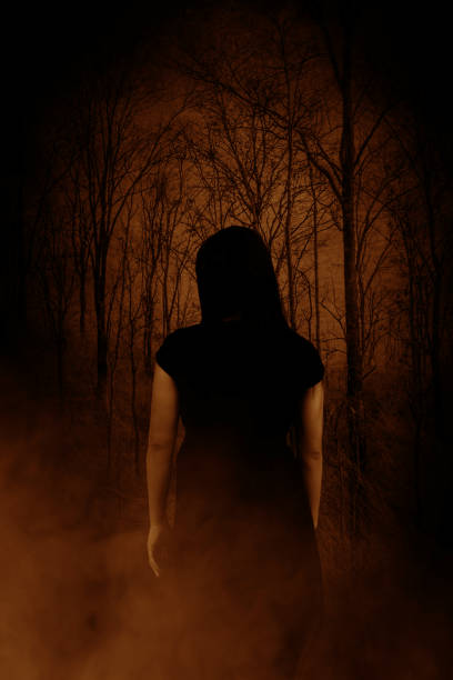 istock Ghost woman in haunted forest 812847966