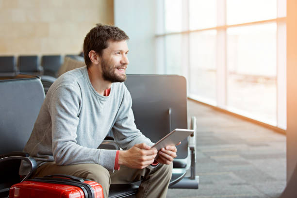 man in airport stock photo