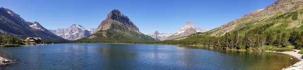 istock Panoramic view of lake and mountains, Glacier National Park 812890906