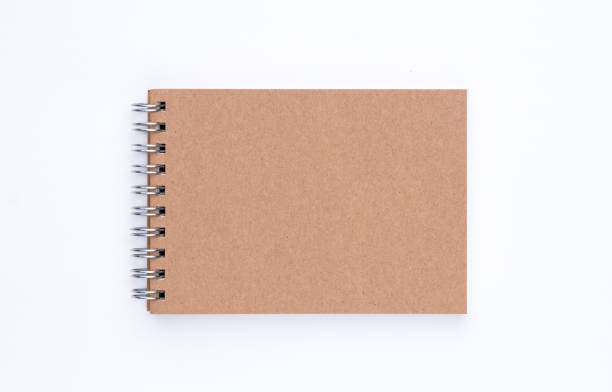 istock The top view of  brown cover spiral notebook on white background 812901630