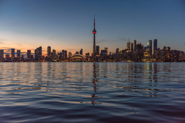 istock Toronto sunset over lake panorama with CN Tower, urban skyline. 812908370
