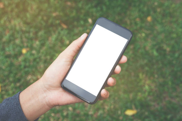 close-up on hand hold phone showing white screen
