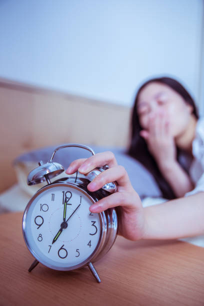 istock turning off the alarm clock in the morning 812928612