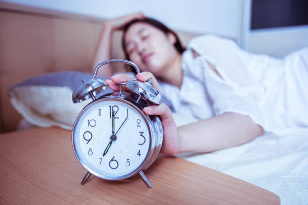 Let me sleep for a while turning off the alarm clock in the morning smash alarm clock stock pictures, royalty-free photos & images