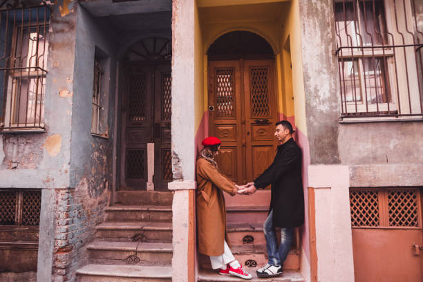 happy couple in love on the background of old colorful painted facade. old streets of istanbul - sexual issues sexual activity couple tan imagens e fotografias de stock