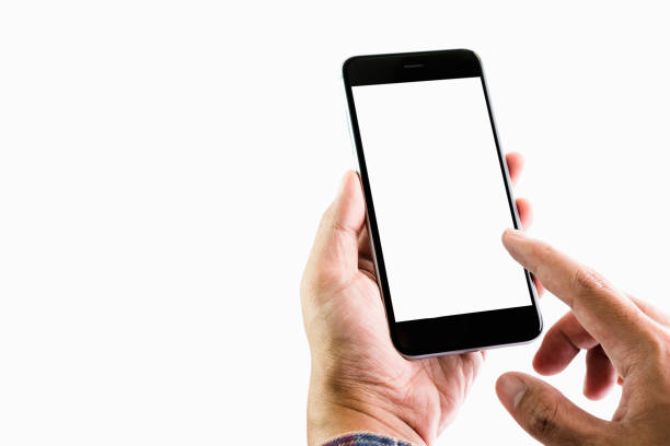 Koszalin, Poland - October 26, 2014: Close-up shot of iPhone 6 hand-held by woman on white background. Devices displaying the applications on the home screen. iPhone 6 (4.7 inches) is next generation smartphone from Apple. Device displaying the applications on the home screen.