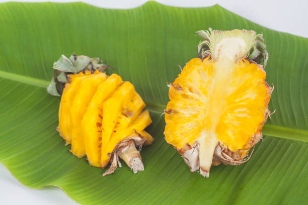 istock fresh slice of sweet pineapple on banana leaf 812952078