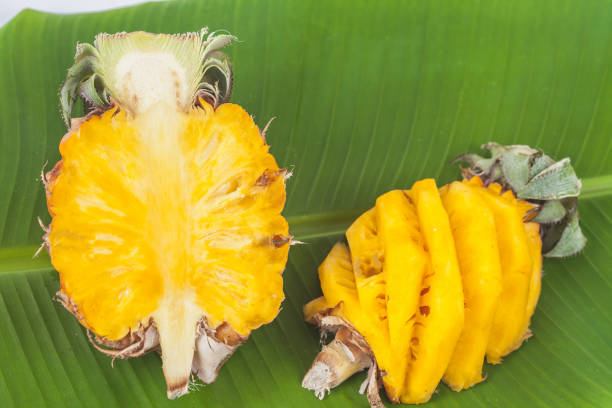 istock fresh slice of sweet pineapple on banana leaf 812952082