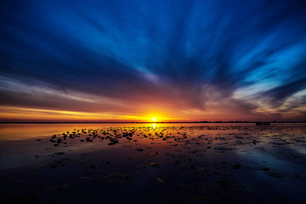 istock amazing sunrise over the lake 812954464