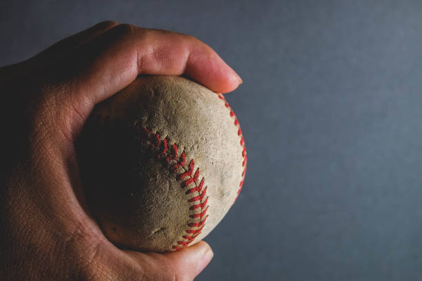 istock old Baseball and glove on wood background with filter effect retro vintage style 812957906