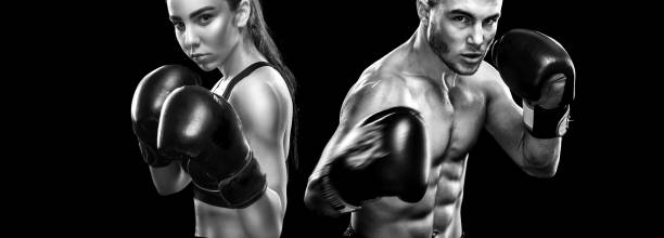 Two sportsmans boxers on black background. Copy Space. Sport concept. stock photo