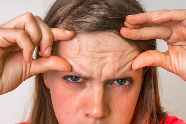 istock Woman with wrinkles on forehead 812960964
