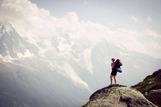istock Female stands and admires the view 812967052