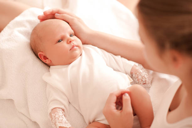 istock Baby girl with mother 812967092