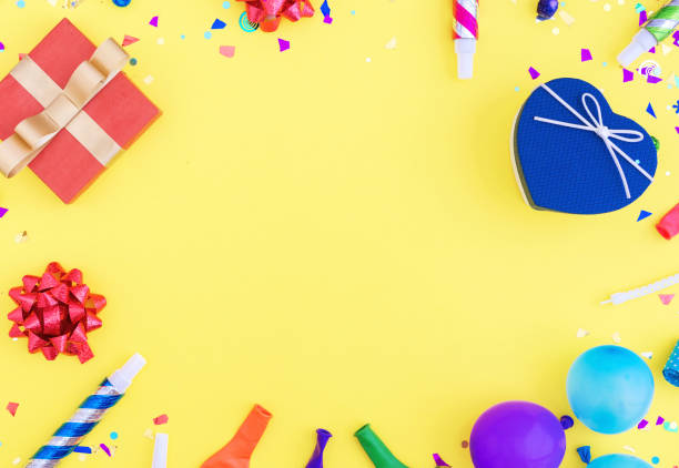 istock Colorful celebration pattern with various party confetti, balloons, gift box on yellow background 812972922