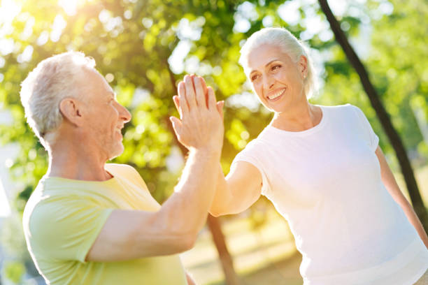 istock Contented aged couple resting in the park 812977024
