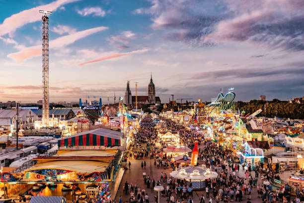 aerial view on oktoberfest in munich at sunset hour - oktoberfest imagens e fotografias de stock