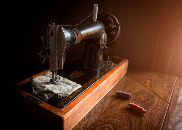 istock Old, vintage sewing machine on a wooden table 812980098