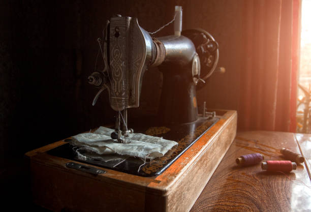 istock Old, vintage sewing machine on a wooden table 812980154