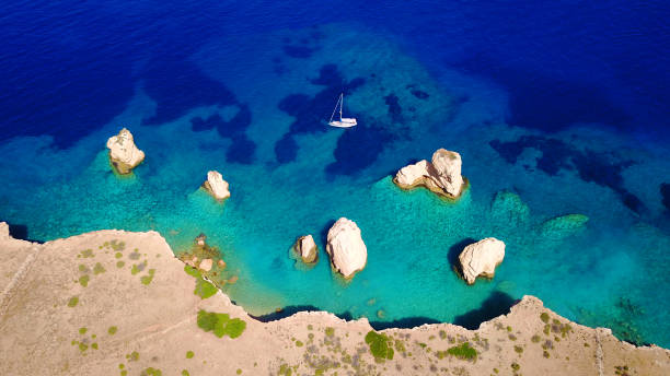 Aerial drone photo of Glaronissi island with clear turquoise waters, Cyclades, Greece stock photo