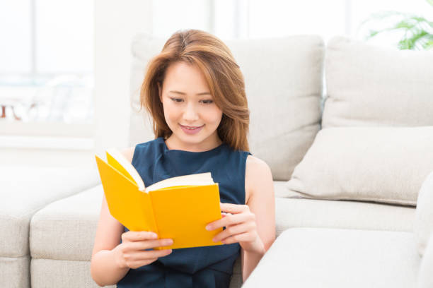 istock woman who reads a book 812983282